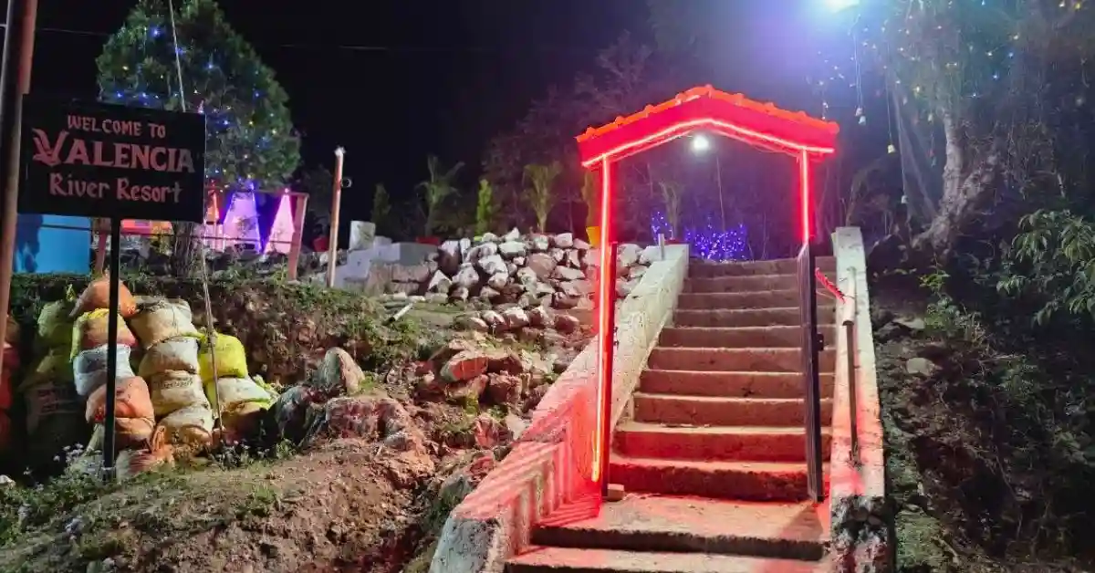 Welcome signboard and neon entrance gate of Valencia River Resort